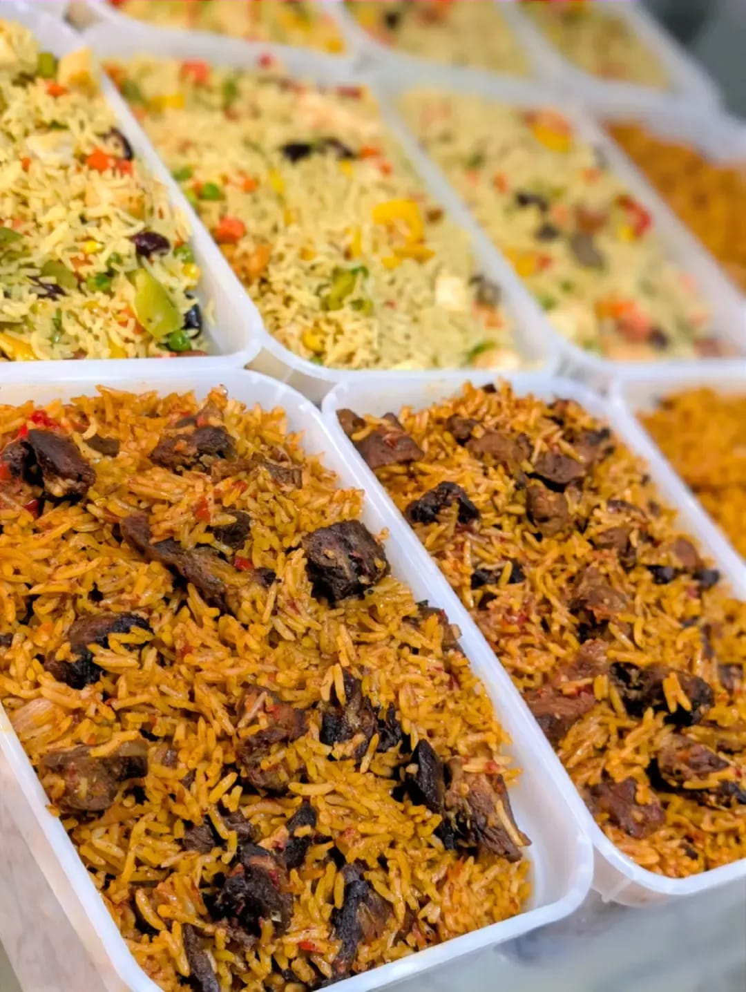 Assorted Nigerian jollof and fried rice trays